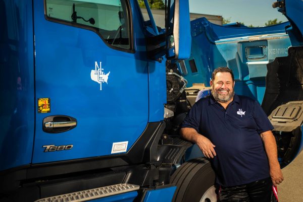 National Carriers Kenworth with The Elite Fleet branding and a livestock trailer
